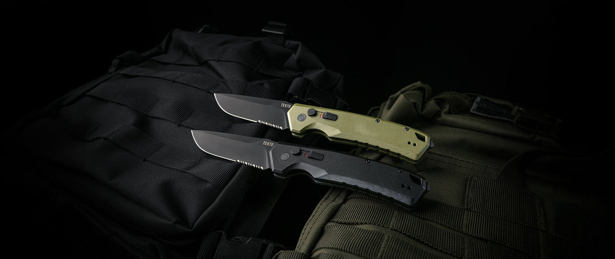 Two TEKTO A3 Delta side-opening automatic knives in black and OD green G10 on dark gear