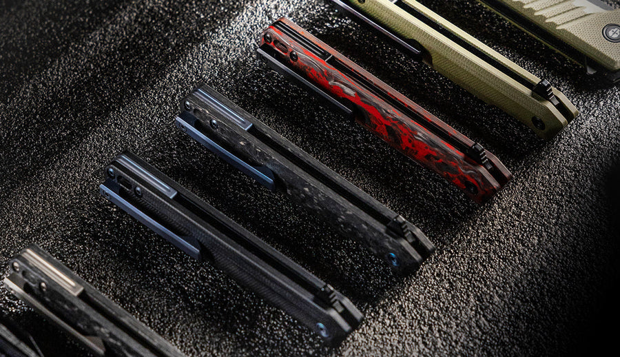 A collection of TEKTO F2 Bravo folding knife handles with titanium accents