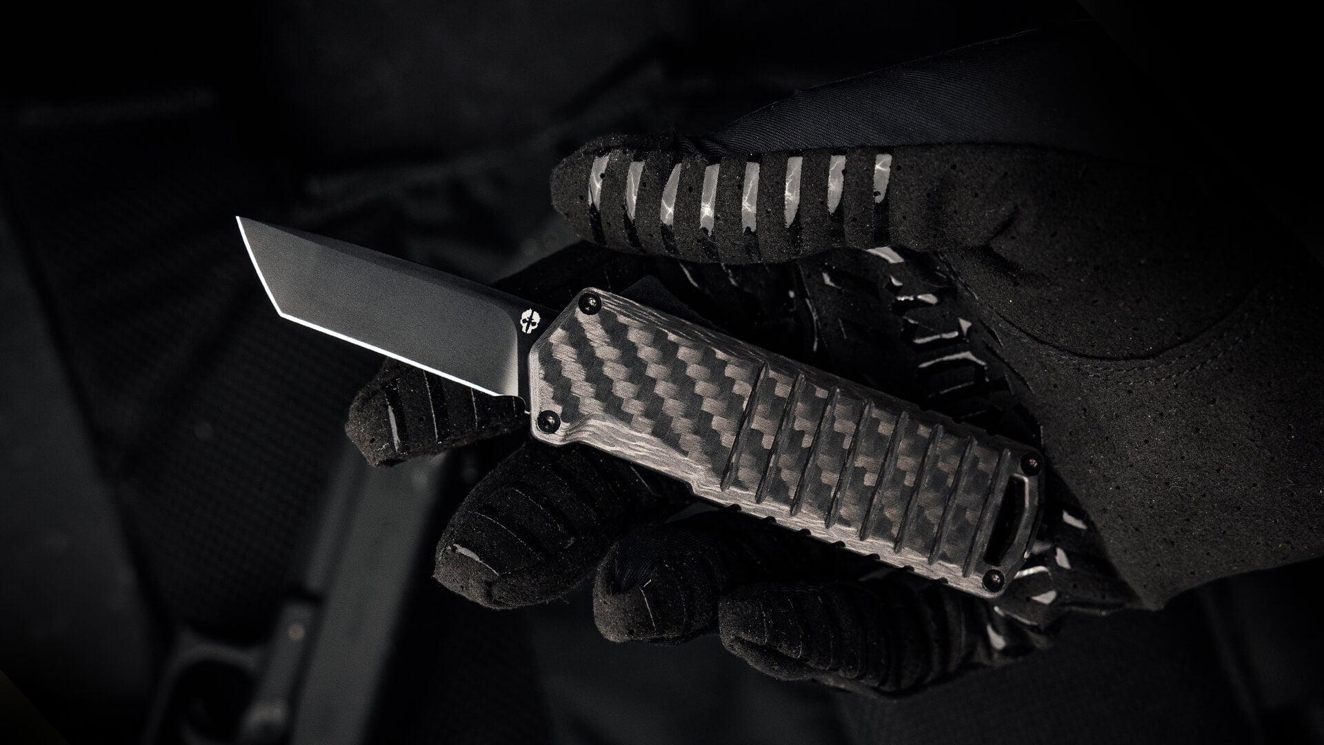 Automatic OTF Knife A2 Badger Carbon Fiber in Gloved Hand Tekto Knives