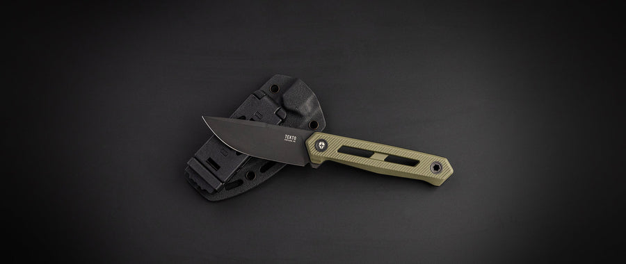 TEKTO X1 Atlas fixed blade with an OD green handle next to its sheath