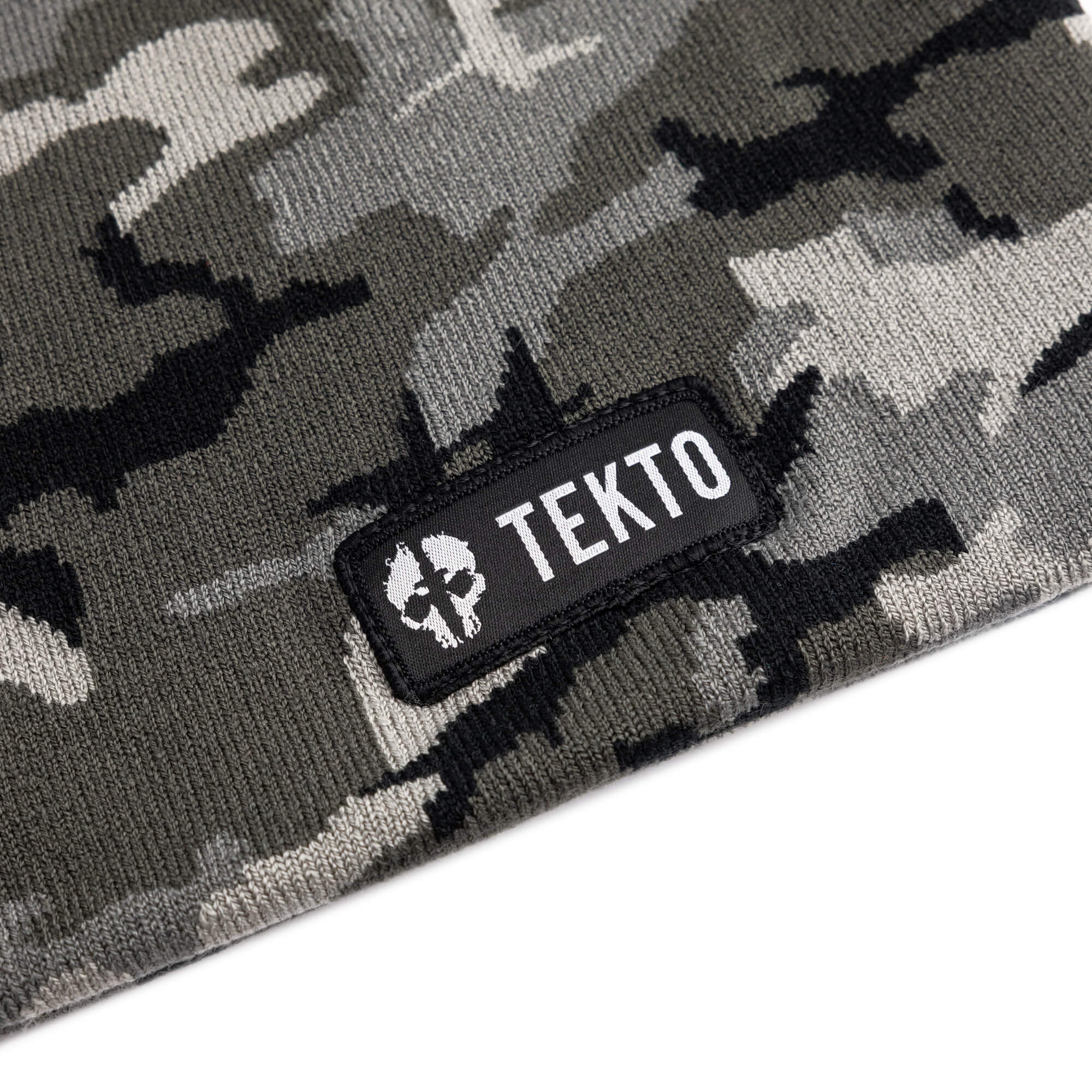 camouflage beanie with a tekto logo patch on a white background